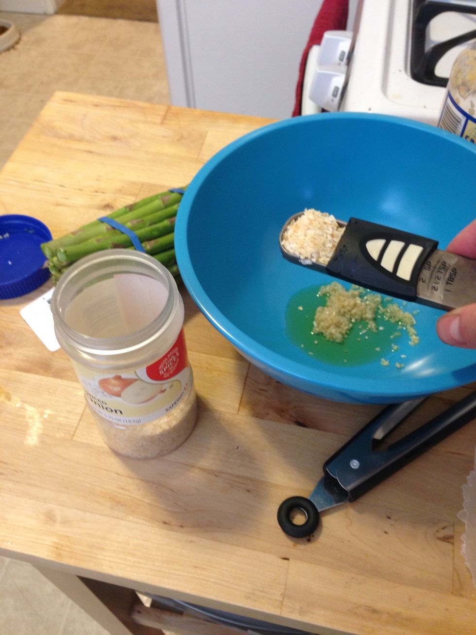 Add 2 tsp of minced onions to the olive oil.