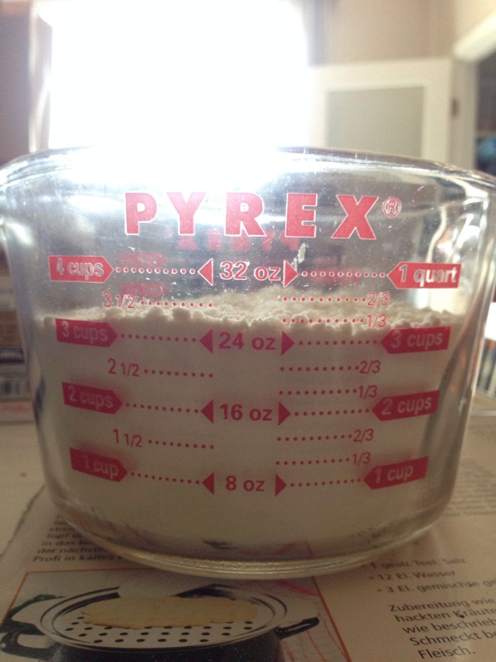 Add 3 1/2 cups of wheat flour to a bowl