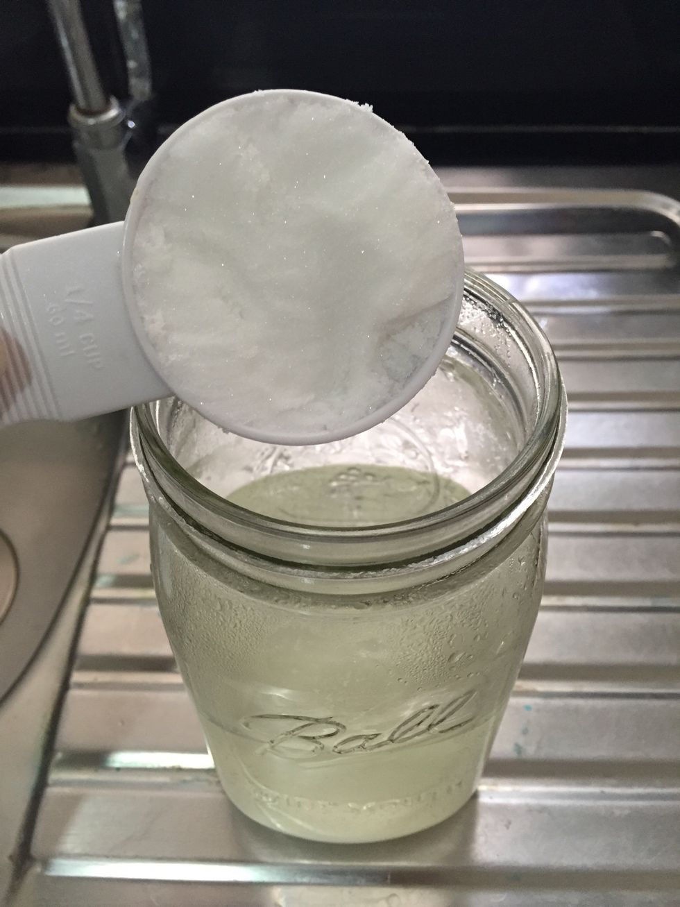 add 3/4 cup alum powder to 2 cups of very hot water in a jar.