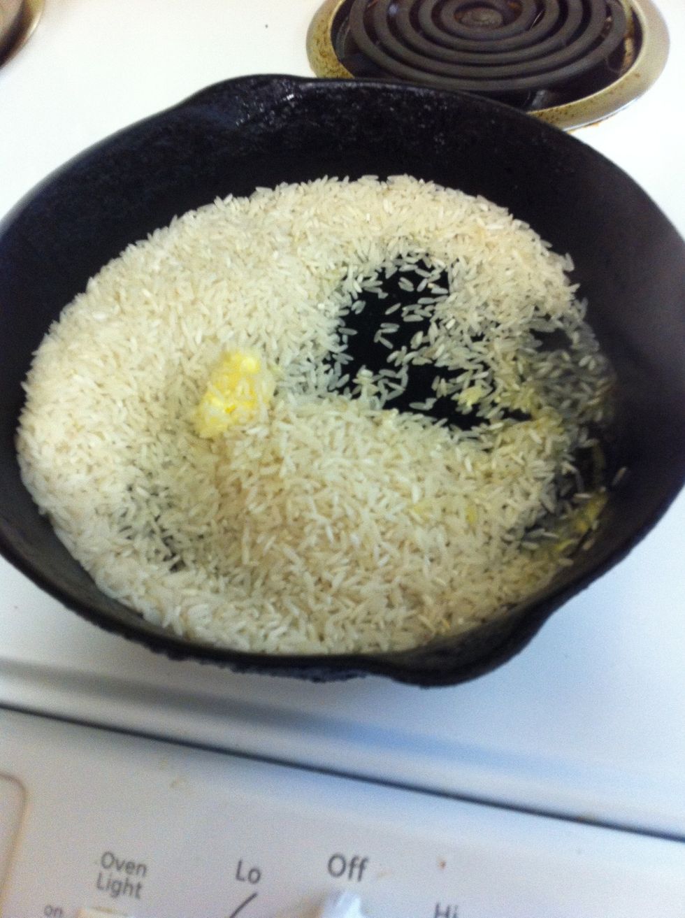 Add 3/4 cup of uncooked rice. You may have enough room for 1 cup of rice if you have a larger skillet. Stir rice until it starts to turn brownish in color.