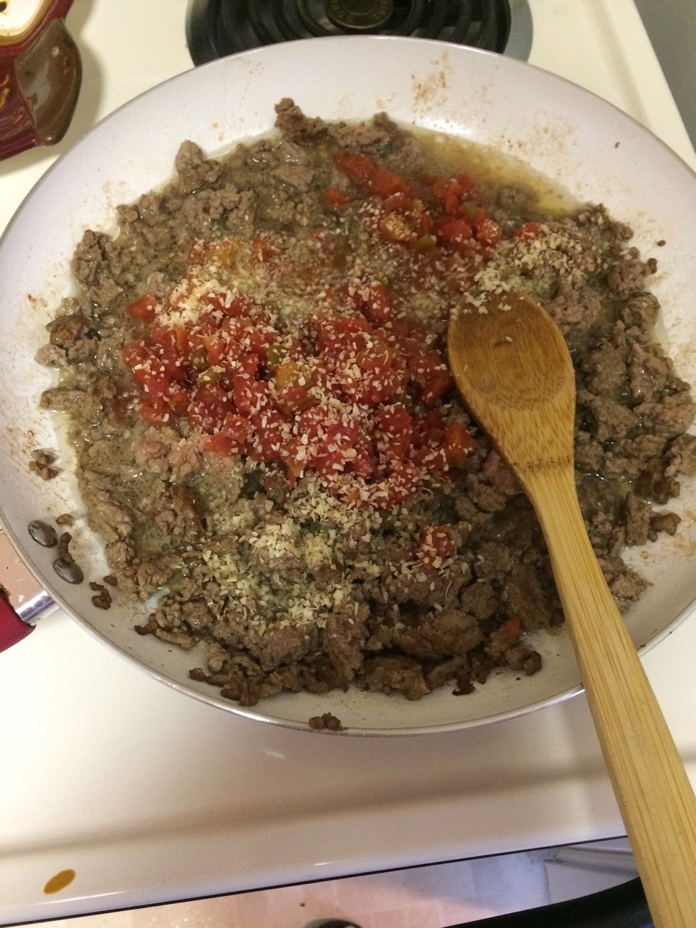 Add 3/4 cup of water to the beef. Add1/3 cup of Mexican style diced tomatoes. Also add 2 tablespoons of taco sauce and taco seasoning.
