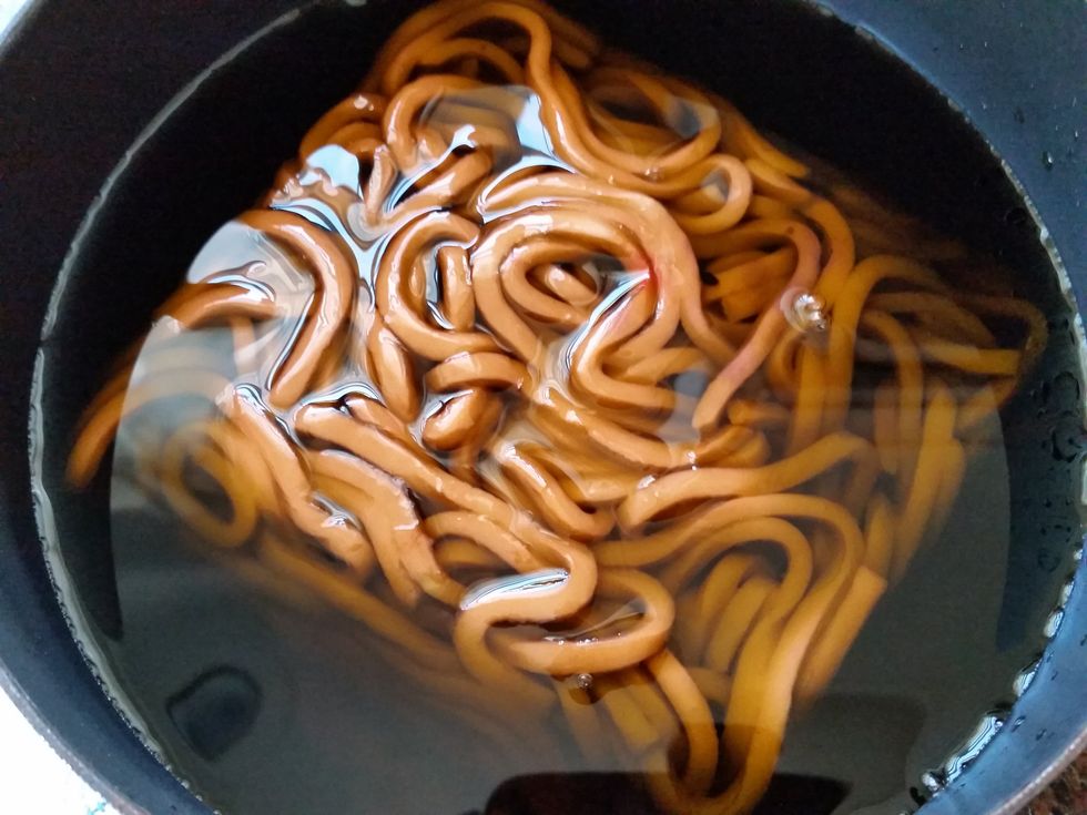 Add 3-4 cups water & 1/4 t. each of orange and purple gel food coloring and whisk until dissolved & add Udon noodles. Let noodles sit for about 10-15 minutes to color the noodles. Heat noodles.