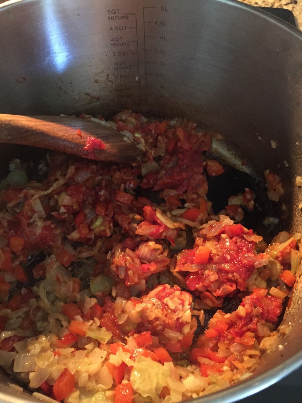 Add 3/4 of a can of tomato paste and brown