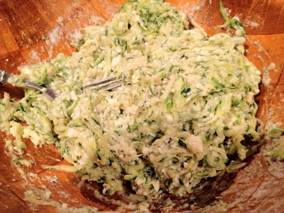 Add 3 big spoonfuls of flour, mix again. Done. The mixture should be moist, not dry, not runny and watery.