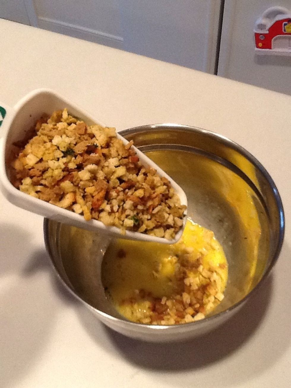 Add 3 cups of stuffing mix to egg. Stir.