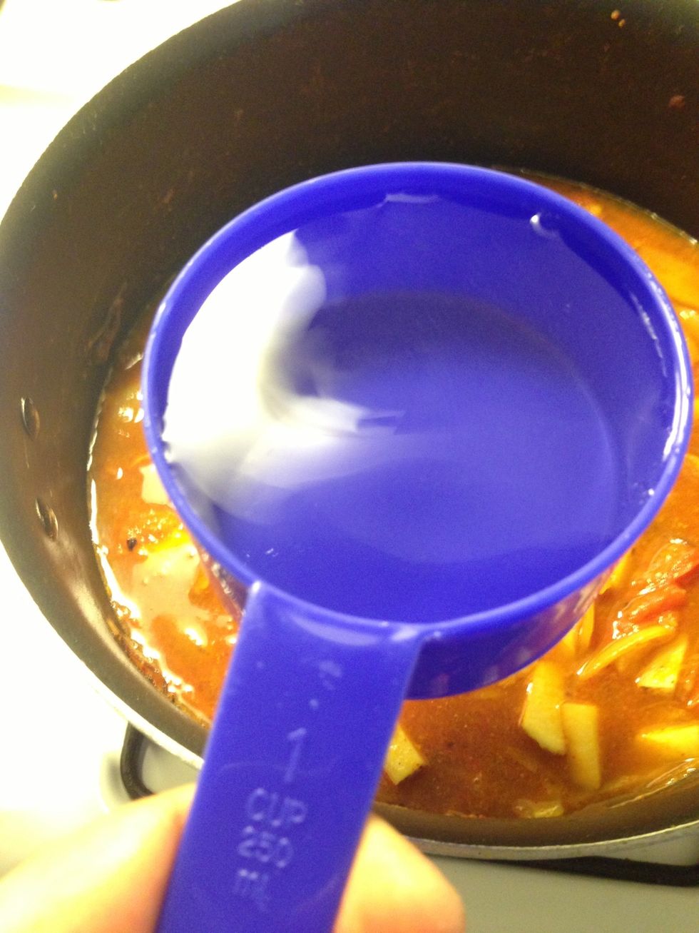 Add 3 cups of water and bring it to boil and keep stirring from time to time until potatoes are soft and cooked. Then add 2 more cups of water and bring to boil.