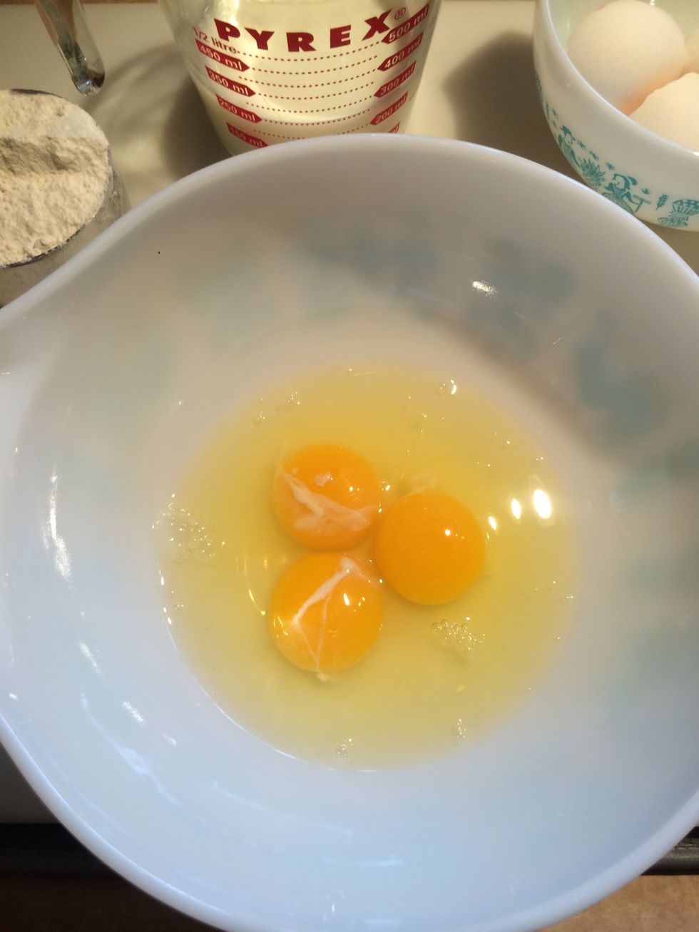 Add 3 eggs to large mixing bowl and whisk thoroughly.