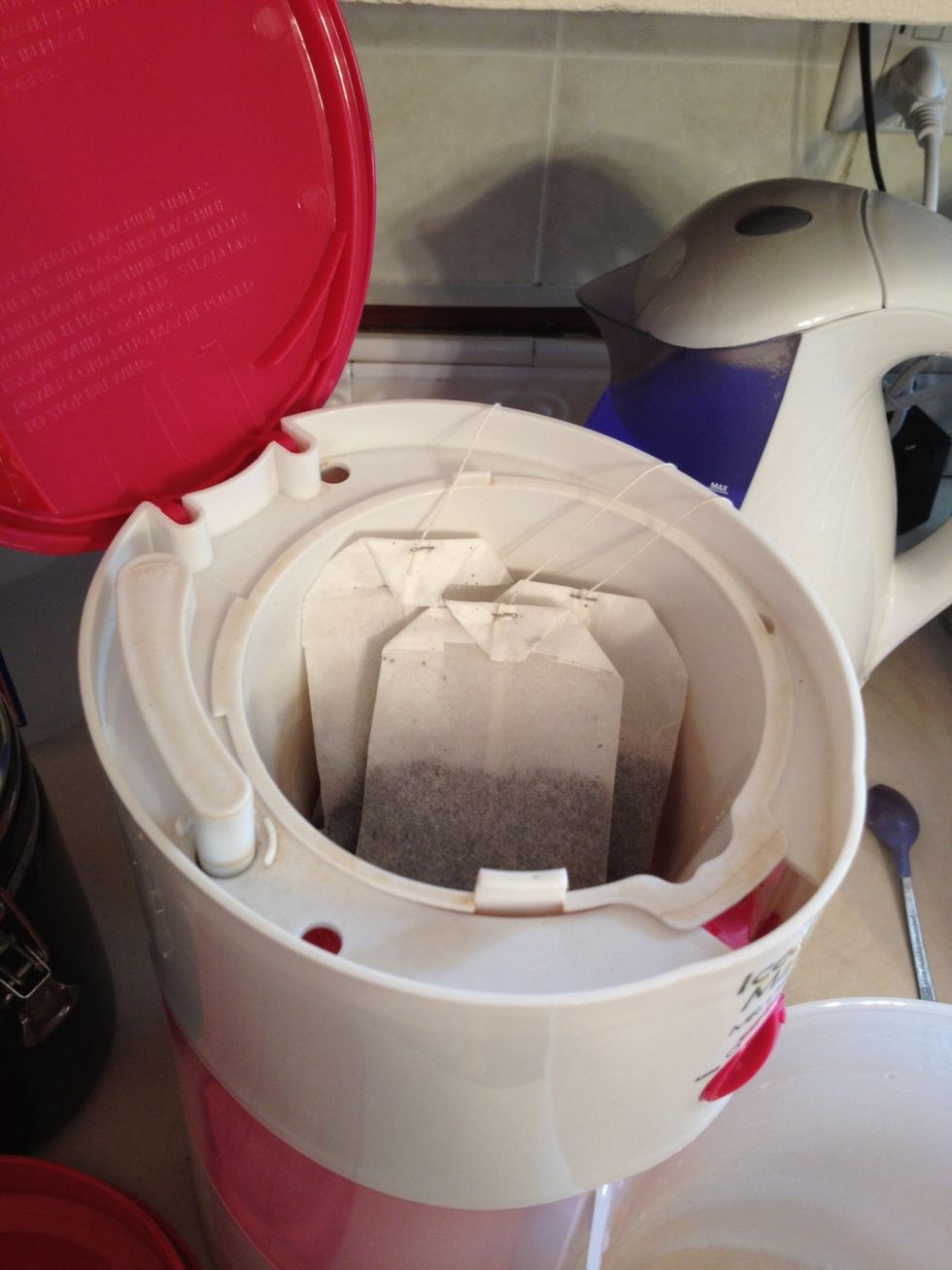 Add 3 family sized tea bags of your favorite brand of tea. Each bag will work for 1 quart of water. At this point you may also add an additional flavored bag of tea of any you may have laying around.