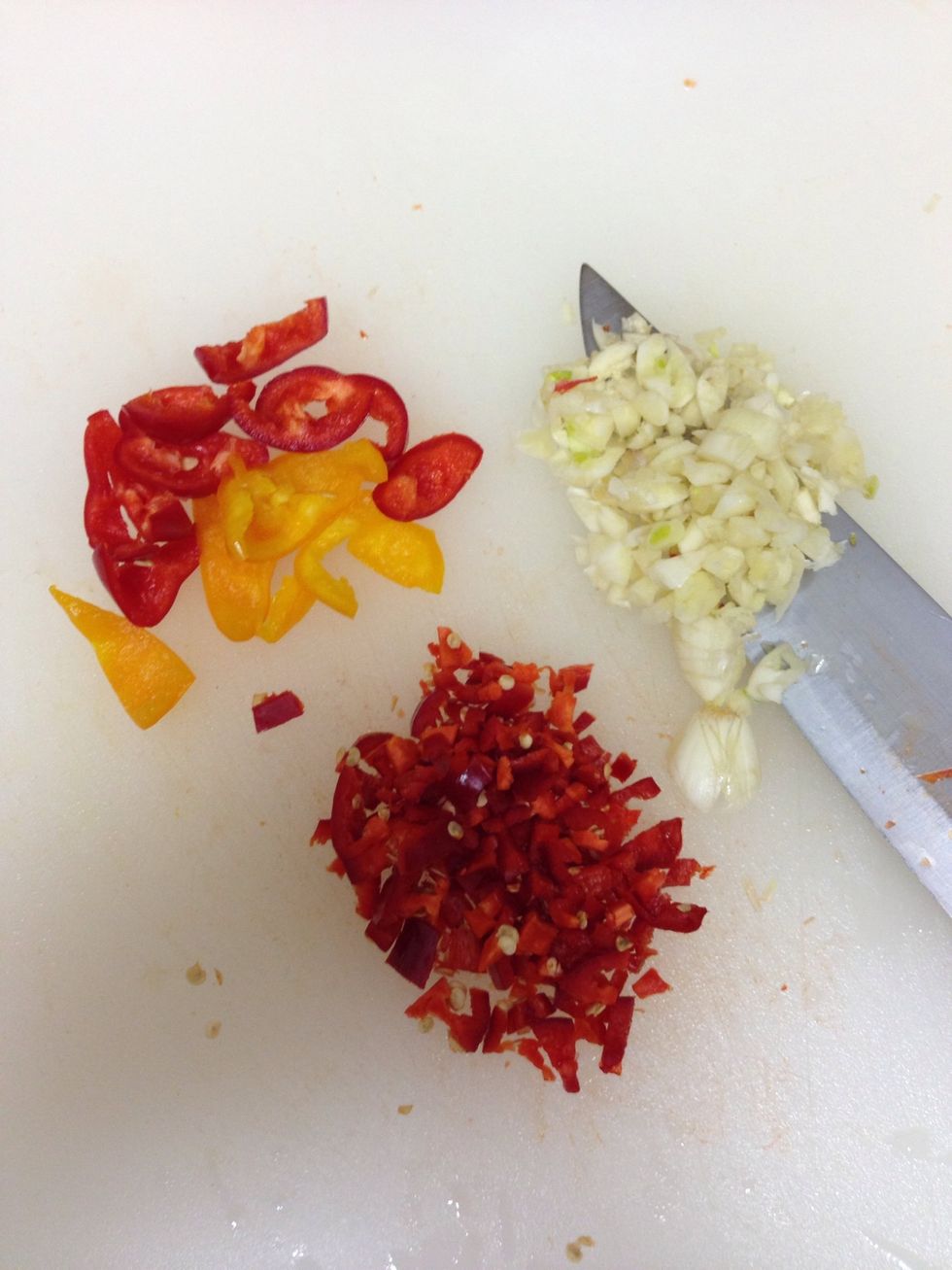 Add 3 garlic cloves 3 baby peppers & 1 Fresno pepper
