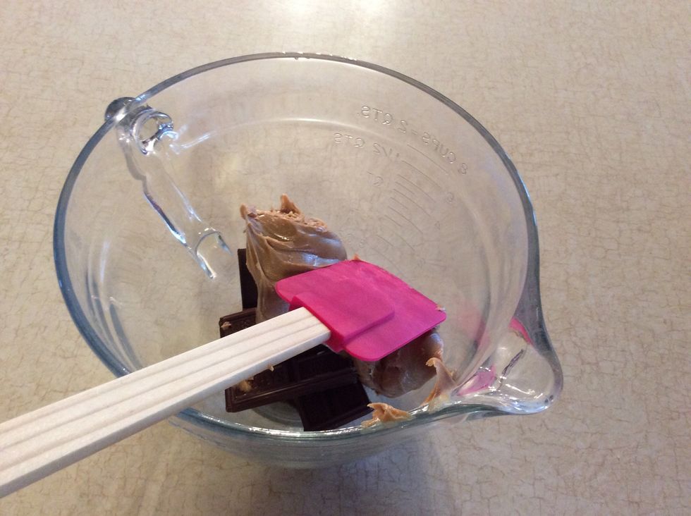Add 3 Hershey bars and 1 cup of peanut butter, put in microwave for 30 seconds and stir repeat until completely smooth