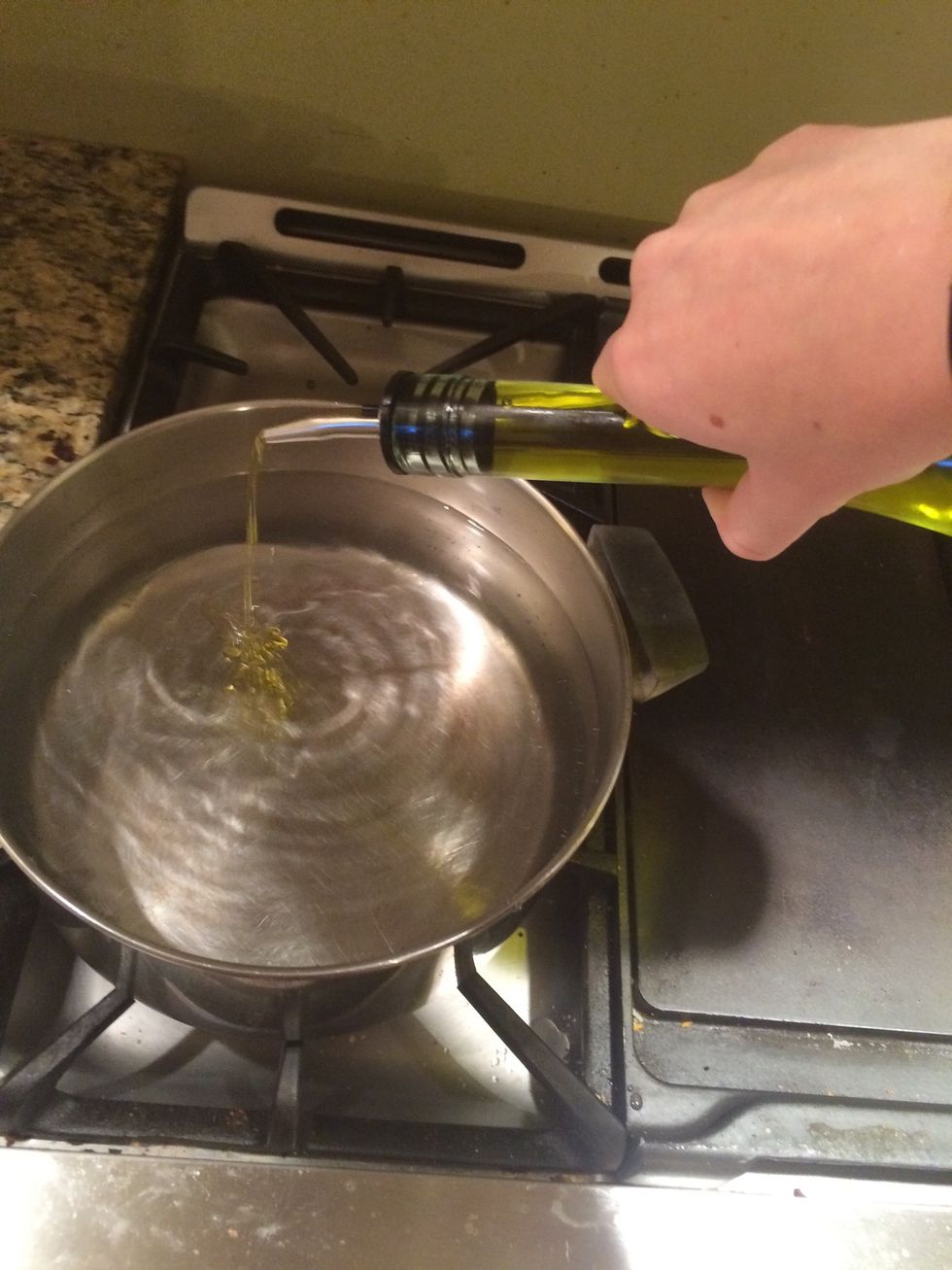 Add 3 quarts of water to a pot, then add vegetable oil and set to a boil