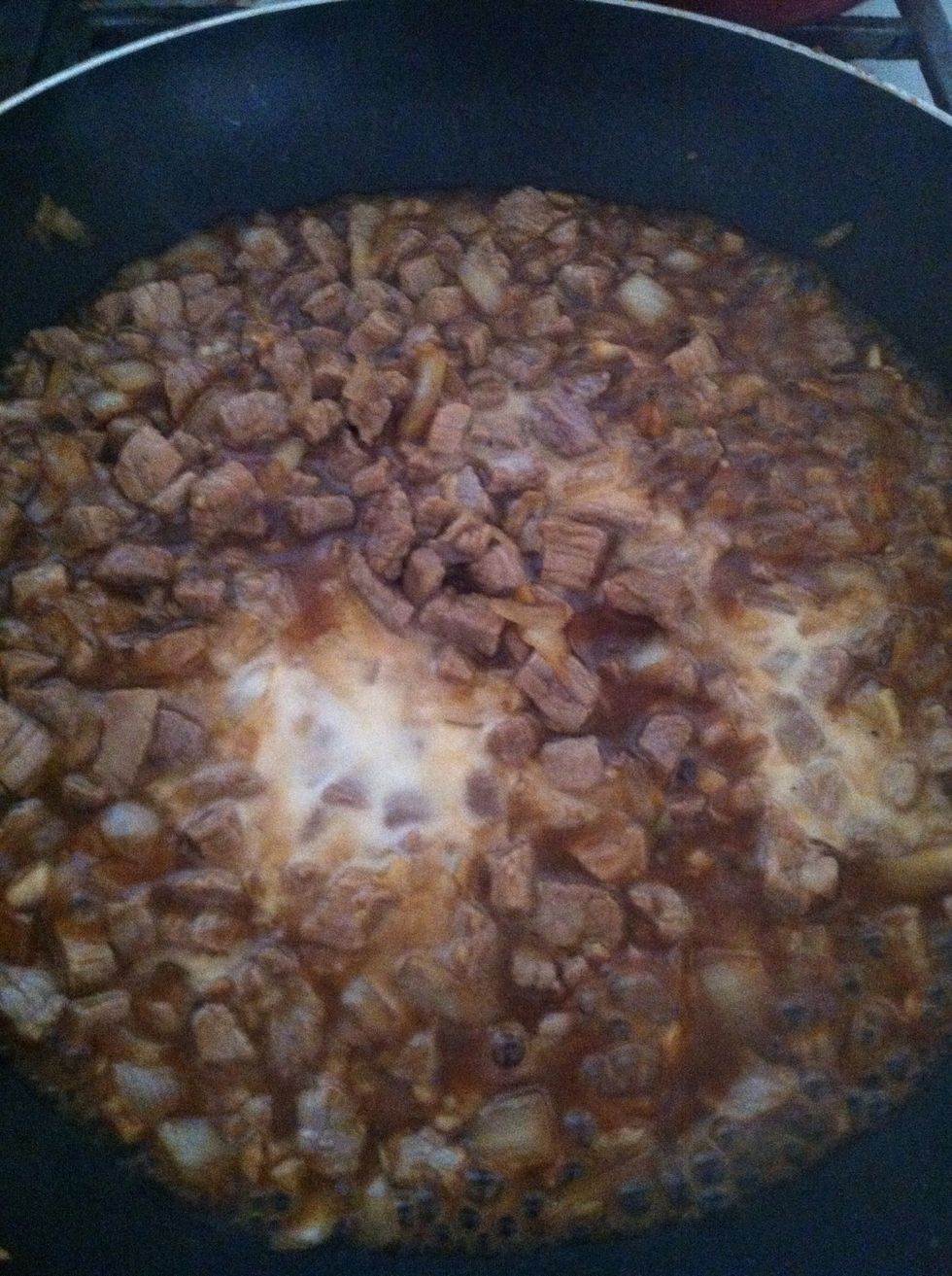 Add 3 tbs of soy sauce and1 tbs of oyster sauce. In a small bowl put 1 tbs of cornstarch, add 3 tbs of water and mix till smooth, then add it to the pan