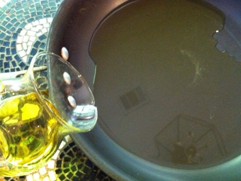 Add 3 \u2013 4 tablespoons of extra virgin oil to a large skillet, and heat on medium.