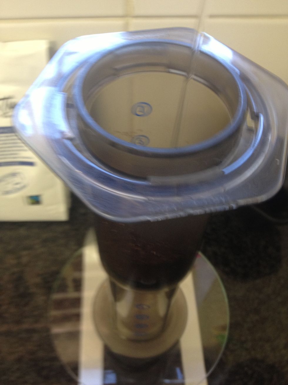 Add 30g of the water for the first pour.