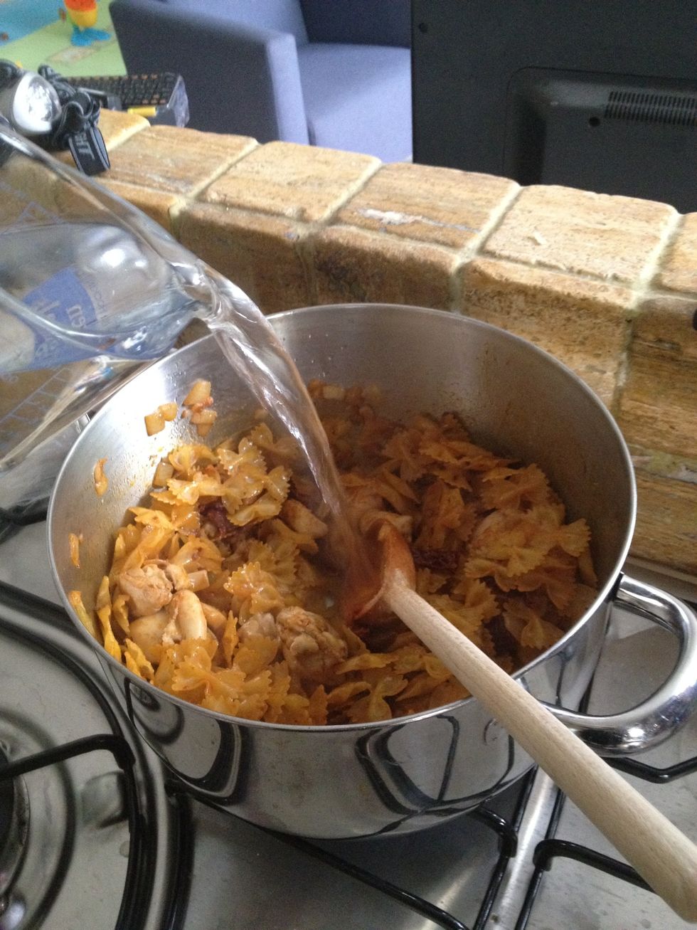 Add 4-5 cups of hot water (the amount of water may vary according to the pasta you're using)