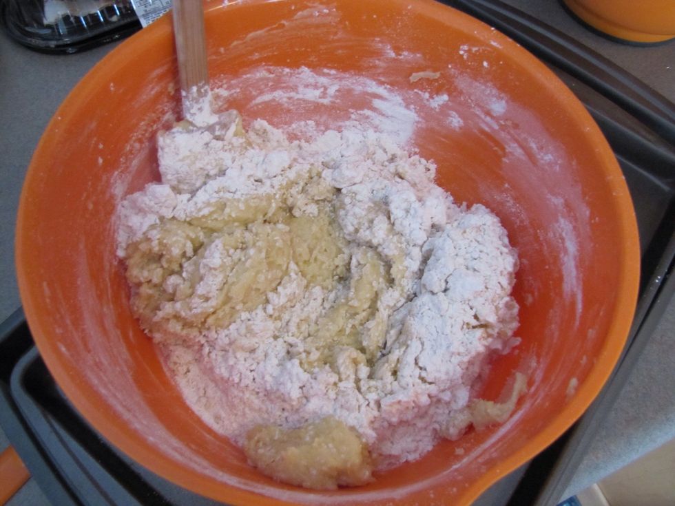 Add: 4 c. & 4 Tbsp. flour, 1 tsp. baking soda, 1 tsp. cream of tartar. Mix everything together until you can't see any white specks of flour in the dough.