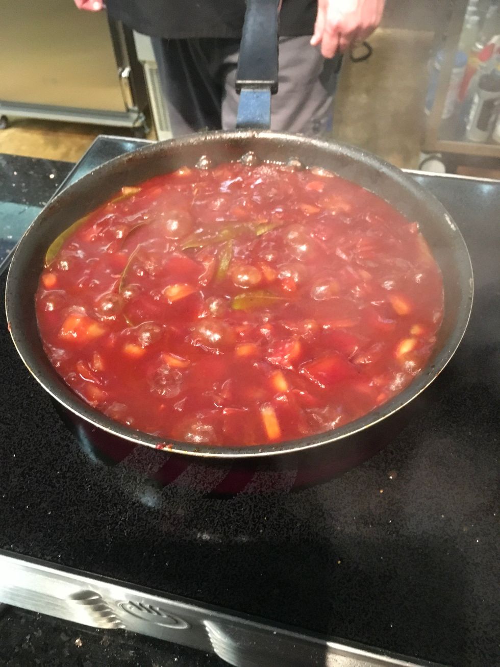 Add 4 cups of red wine and reduce.