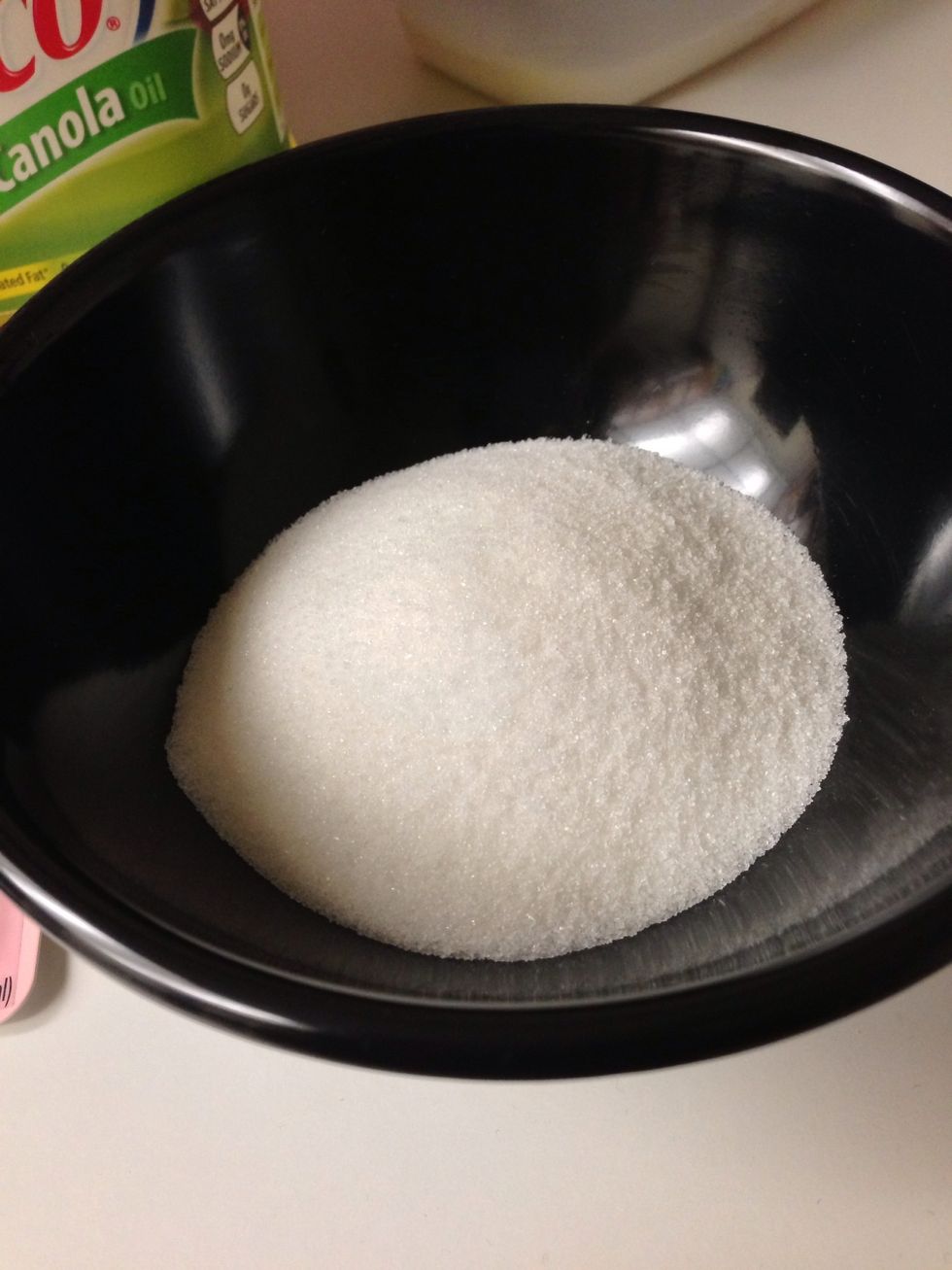Add 4 cups of sugar into bowl for mixing.