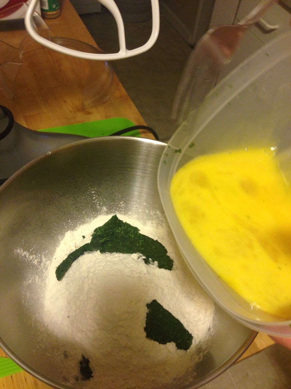Add 4 eggs to the mixture. We whisked them together so they had the same consistency.