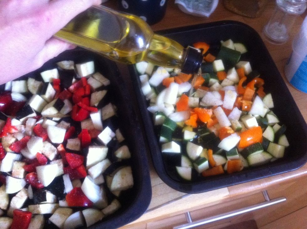 Add 4 good glugs of olive oil to each tin,