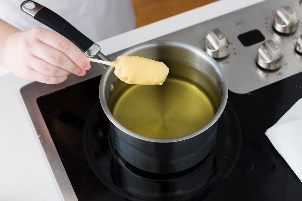 Add 4 inches of oil to a large pot. Using the deep-fry thermometer to heat the oil until it reaches 360 degrees F.