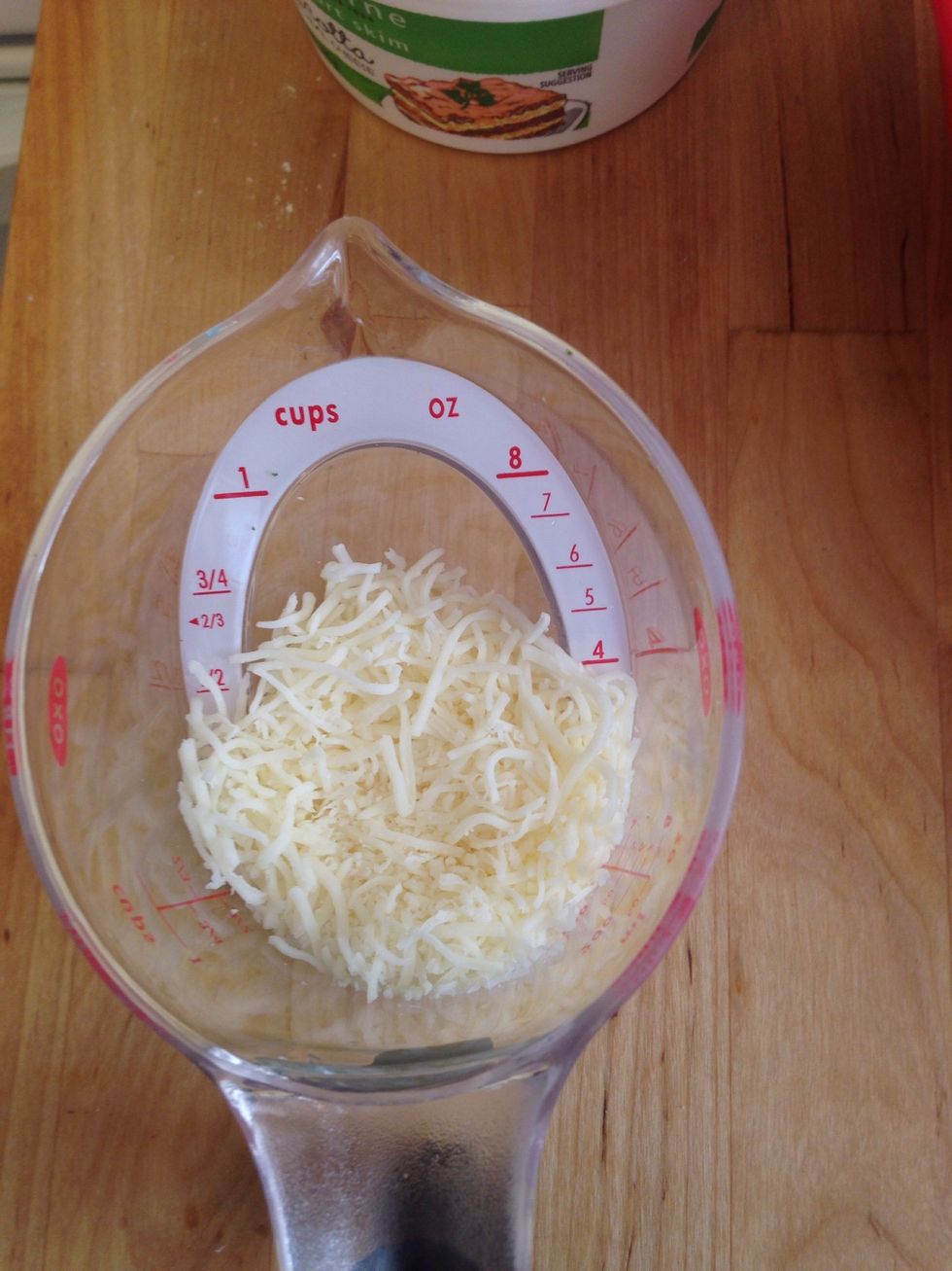 Add 4 oz of Italian cheese to the spinach bowl.