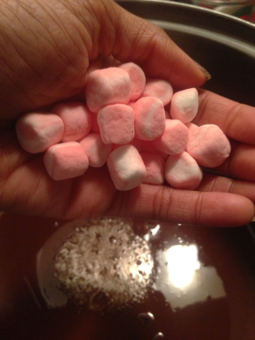 Add 40 miniature peppermint marshmallows to coconut oil - chocolate mixture.