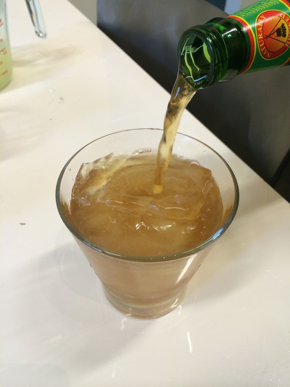 Add 5 ounces of ginger beer to each cup.