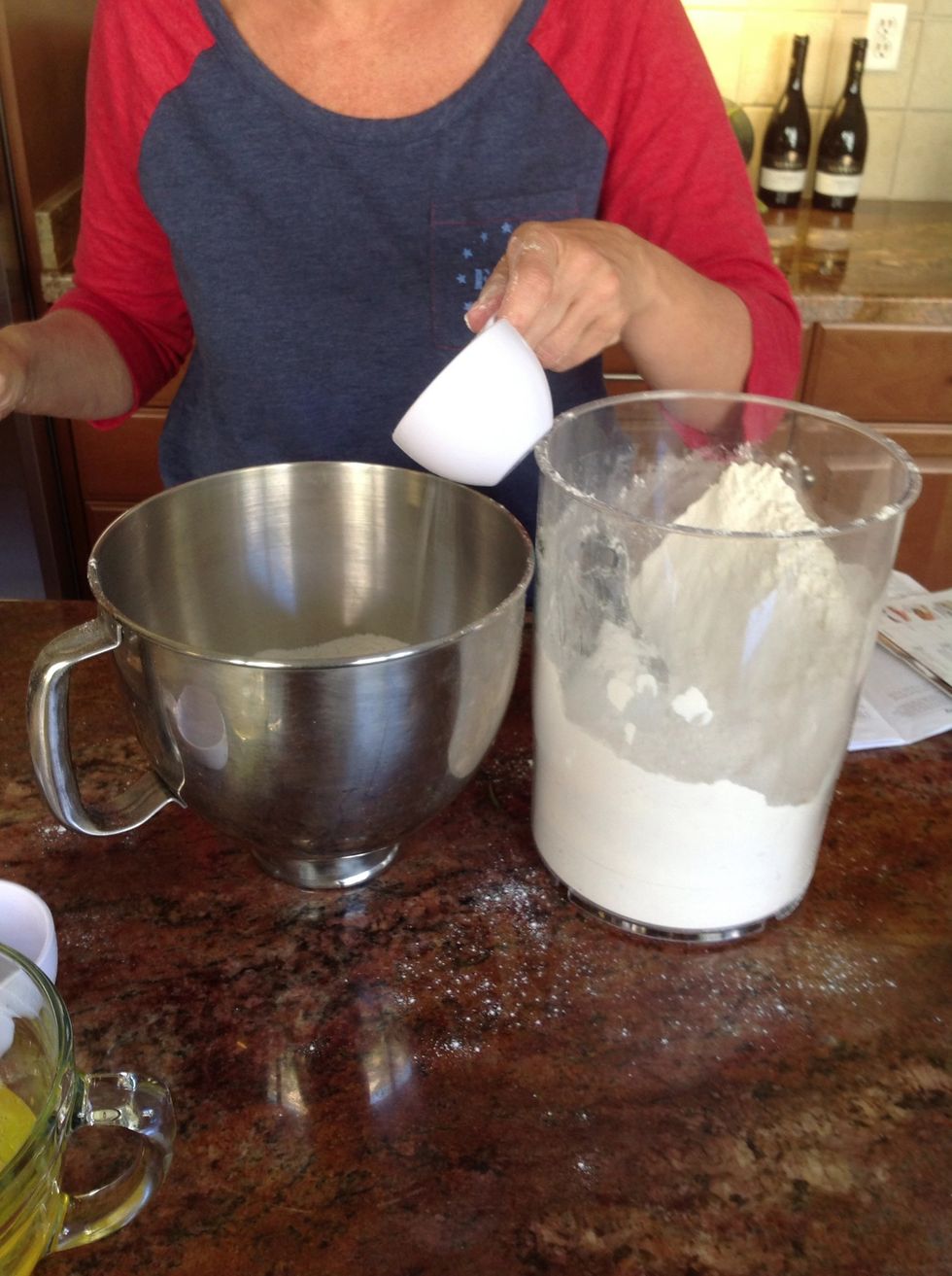 Add 51/2 cups of flour to the mixing bowl.