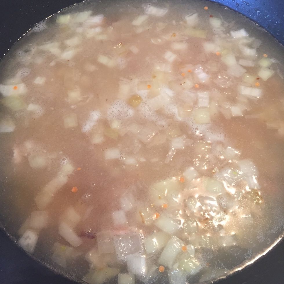 Add 6 cups of chicken stock in it and let it boiled. Then add 2 cups of lentils in the pot.