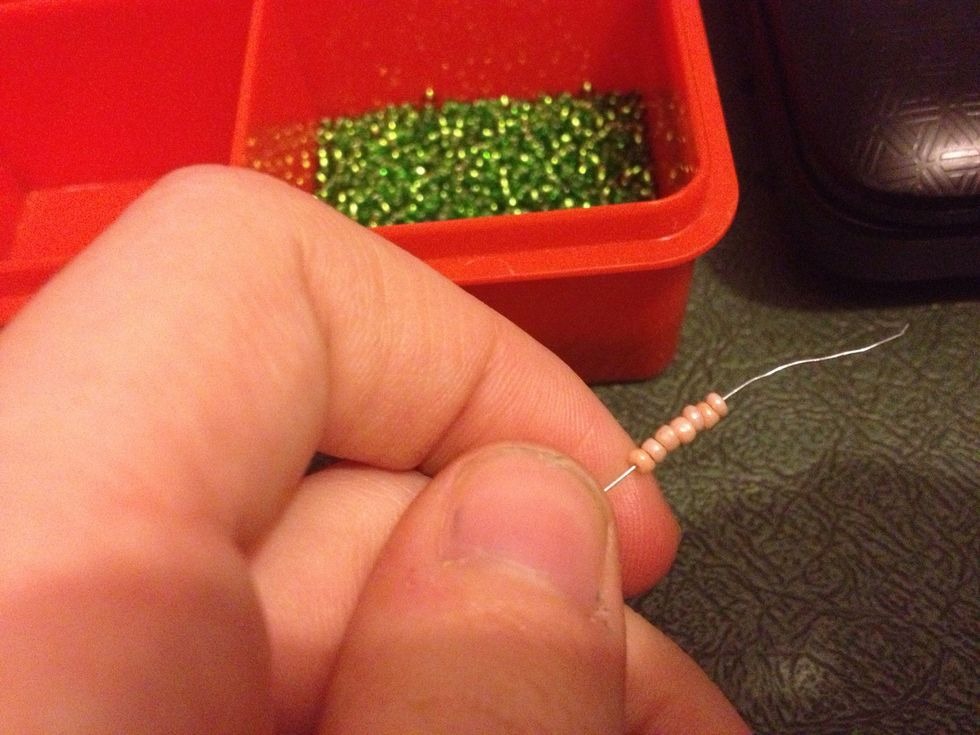 Add 7 beads. Thread opposite wire through