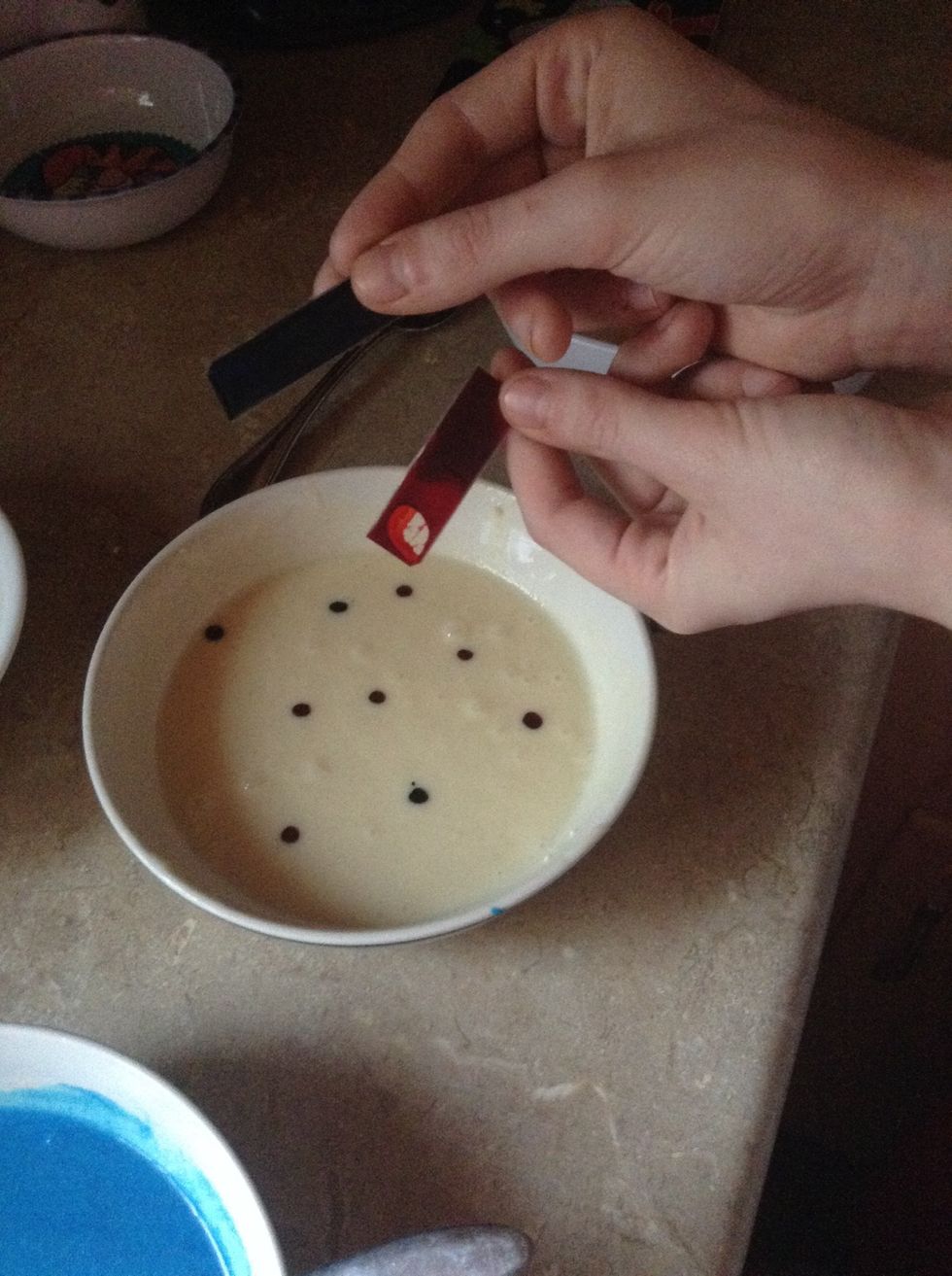 Add 7 drops red and 2 drops blue to create purple then mix