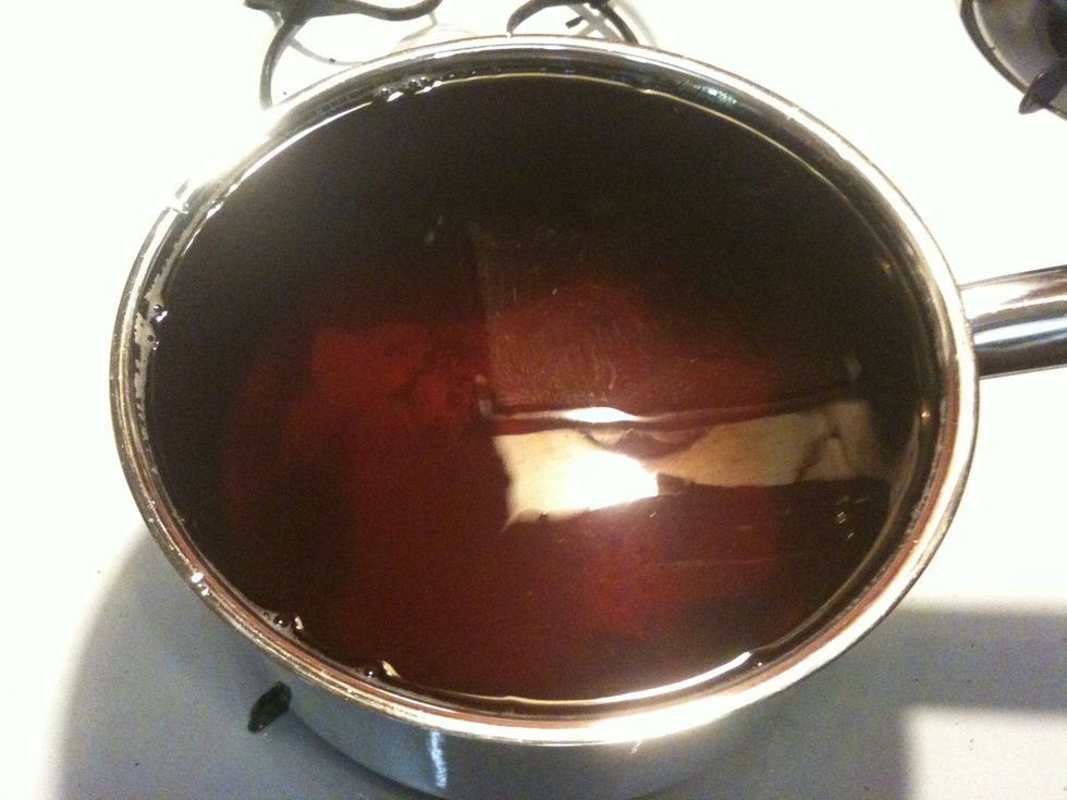 Add 8 cups (.5 gallon) of cool filtered (or bottled) water to the tea. I probably shoulda used a larger pot.