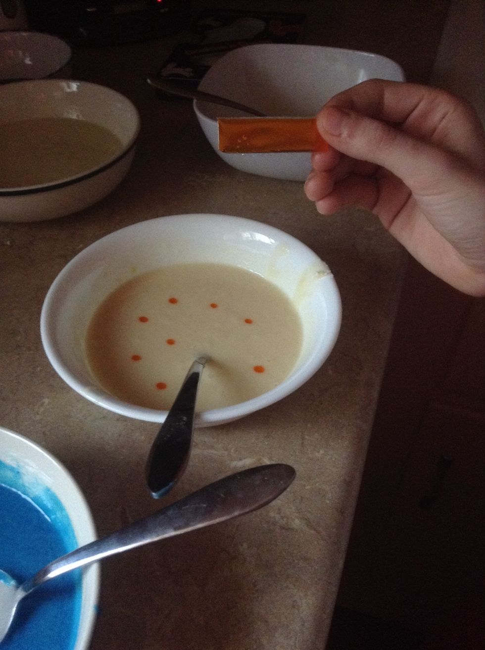 Add 8 drops of yellow dye to a different bowl and mix