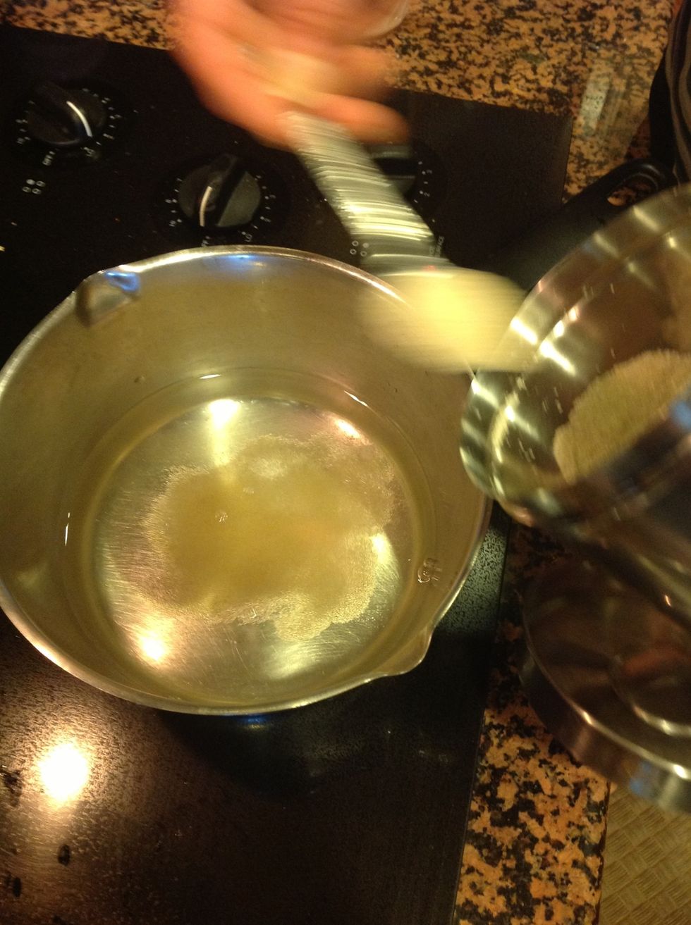 Add 8 teaspoons (4 tablespoons) of sugar to 2 cups of water and bring to a boil