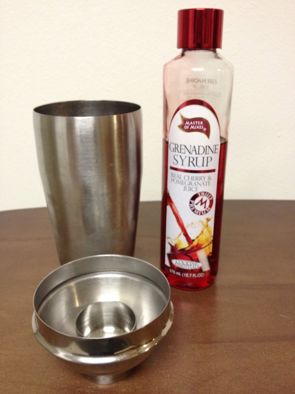 Add a 1/2 ounce of Grenadine into the Shaker/Strainer.