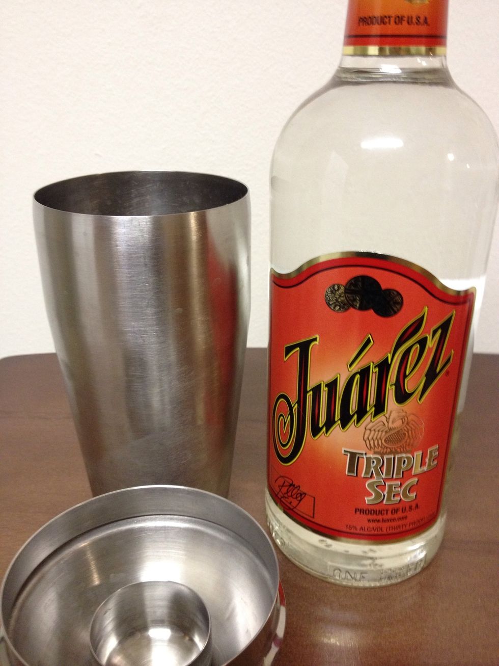 Add a 1/2 ounce of Triple Sec into the Shaker/Strainer.