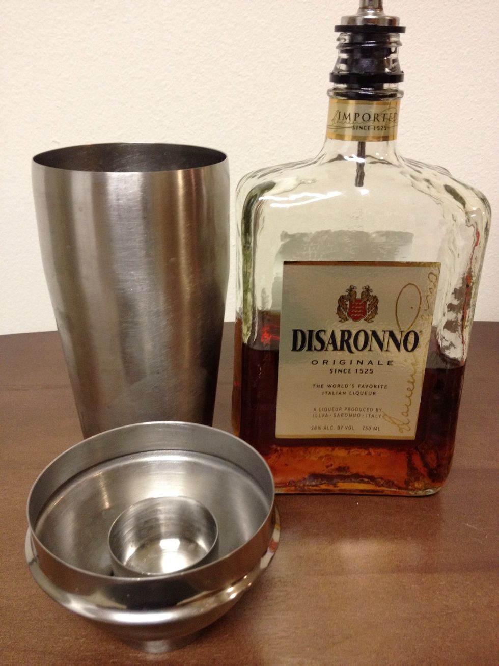 Add a 1/2 ounce of your favorite Amaretto into the Shaker/Strainer.