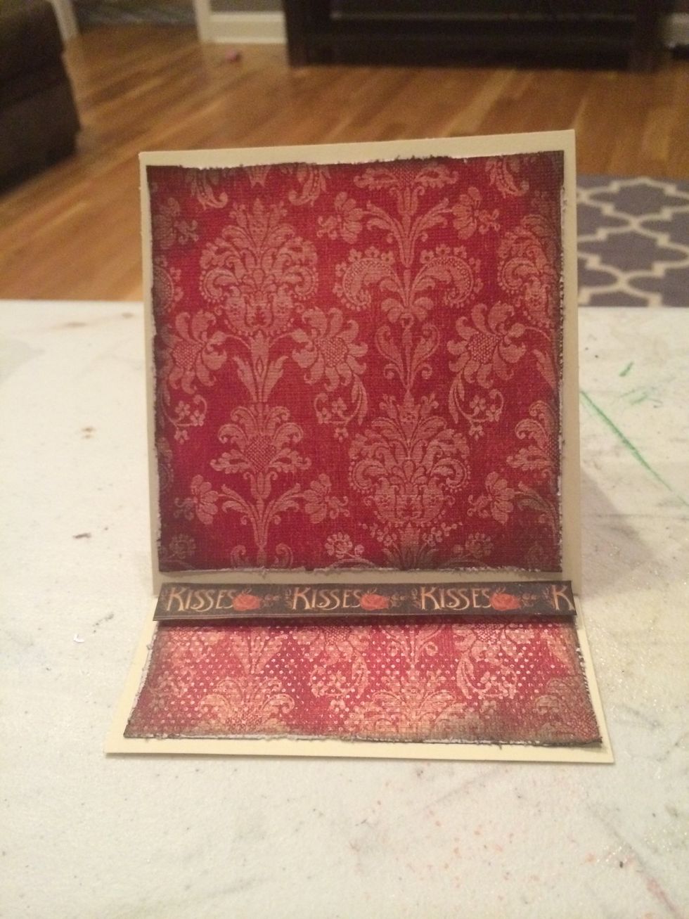 Add a 3/4" x 5" strip of paper to the base/bottom of the card by applying glue dots to the backing. This will allow the card to stand.