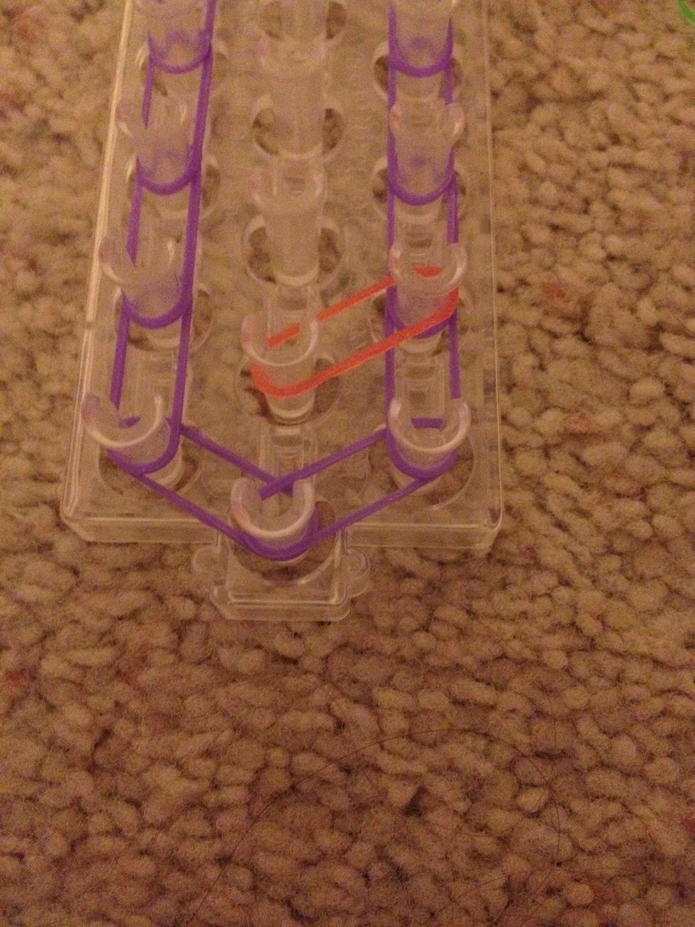 Add a band from the middle to the peg shown