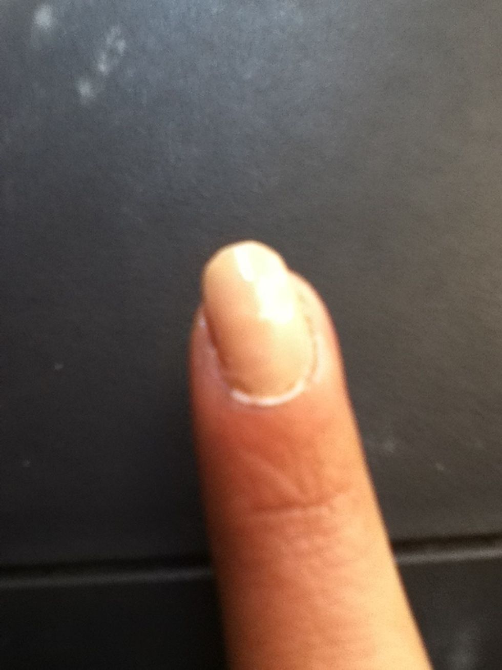 Add a base coat all over your nails Then apply two coats of a nude polish