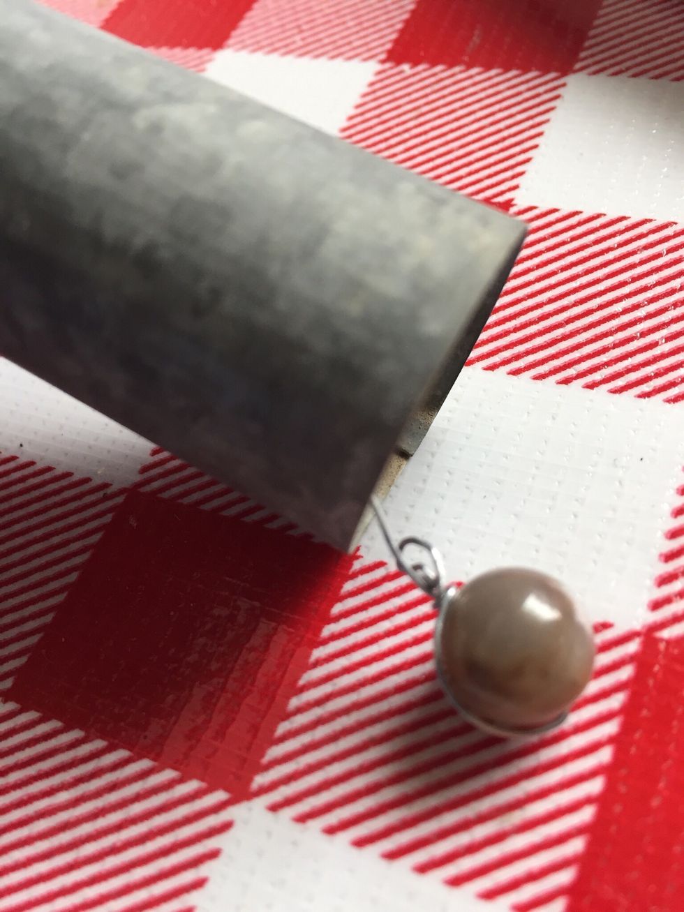 Add a bead on end of wire, twist wire around bead to tightly hold wire.