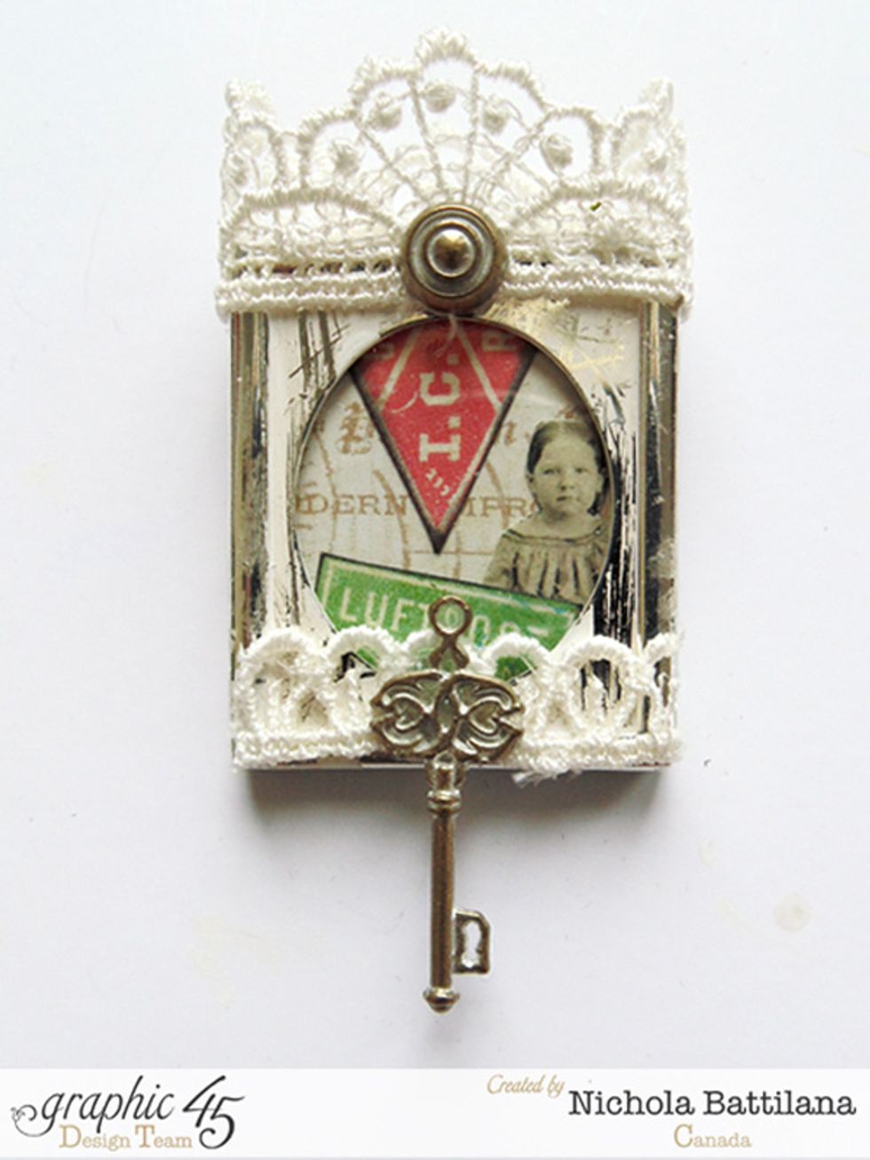 ... add a bit of lace trim, a shabby chic key and brad...