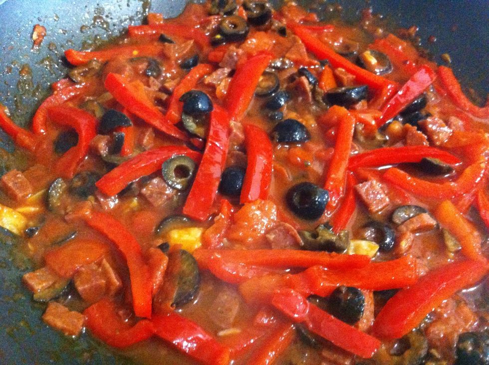 Add a bit of water from the boiling pasta (it contains starch which will both make your sauce more wet and thick) and cook down