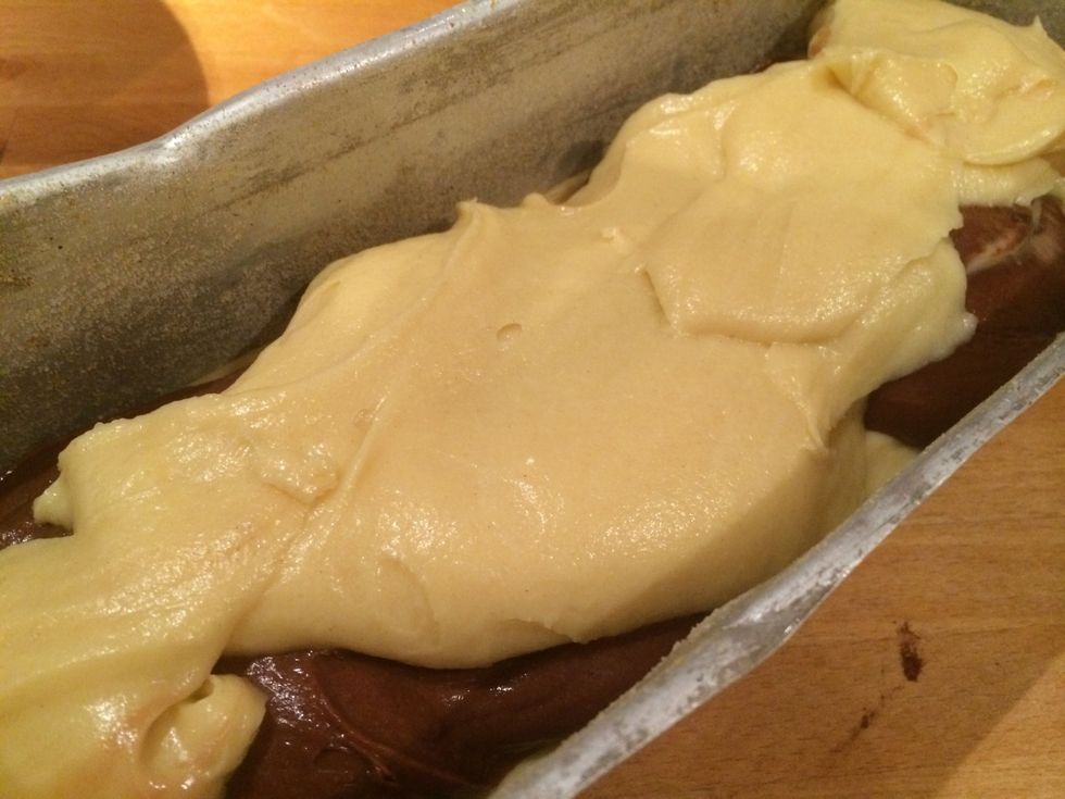 Add a bottom layer of the vanilla batter and then all if the chocolate layer and finally the rest of the vanilla batter.