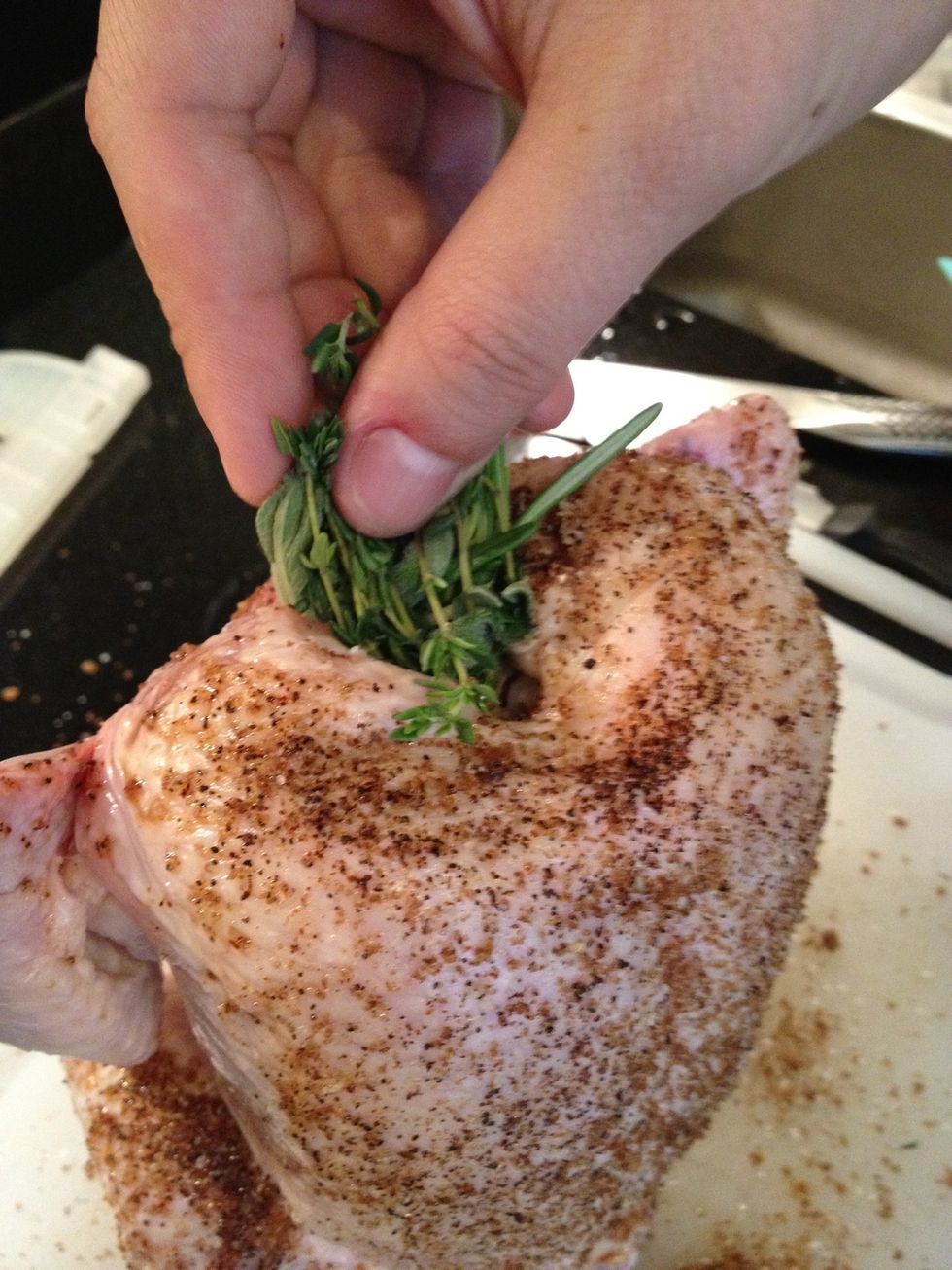 add a bunch it thyme, sage, and rosemary into the neck hole.