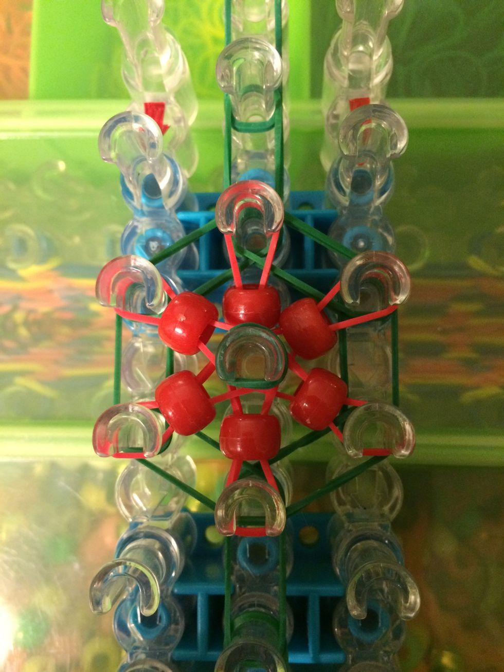 Add a capping band and flip your loom. It's time to start looping.