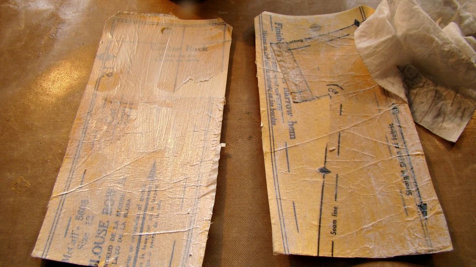 Add a couple coats of white gesso, using a baby wipe to remove excess... you want just a light wash of the gesso on the tags.