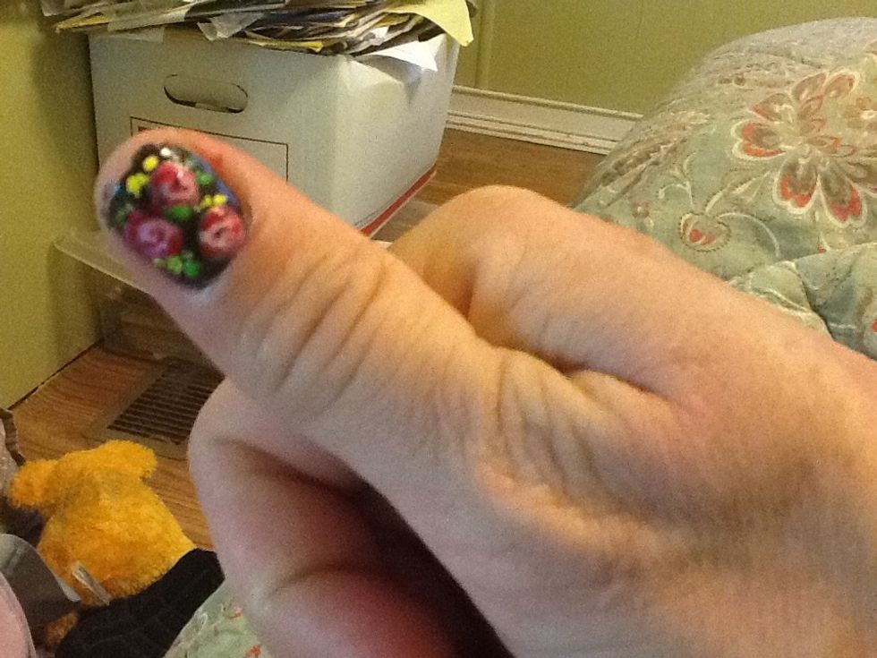 Add a couple of green dashes for detail. (Used a green nail art polish with skinny brush). The green had a hard time showing on top of the black. I re-did it a couple of times.