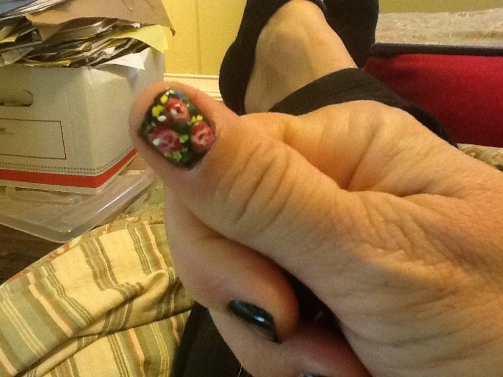 Add a couple of little teensy weensy white dots because...why not? and Voila. A sort of flowers on black vintage nail. Pretty.
